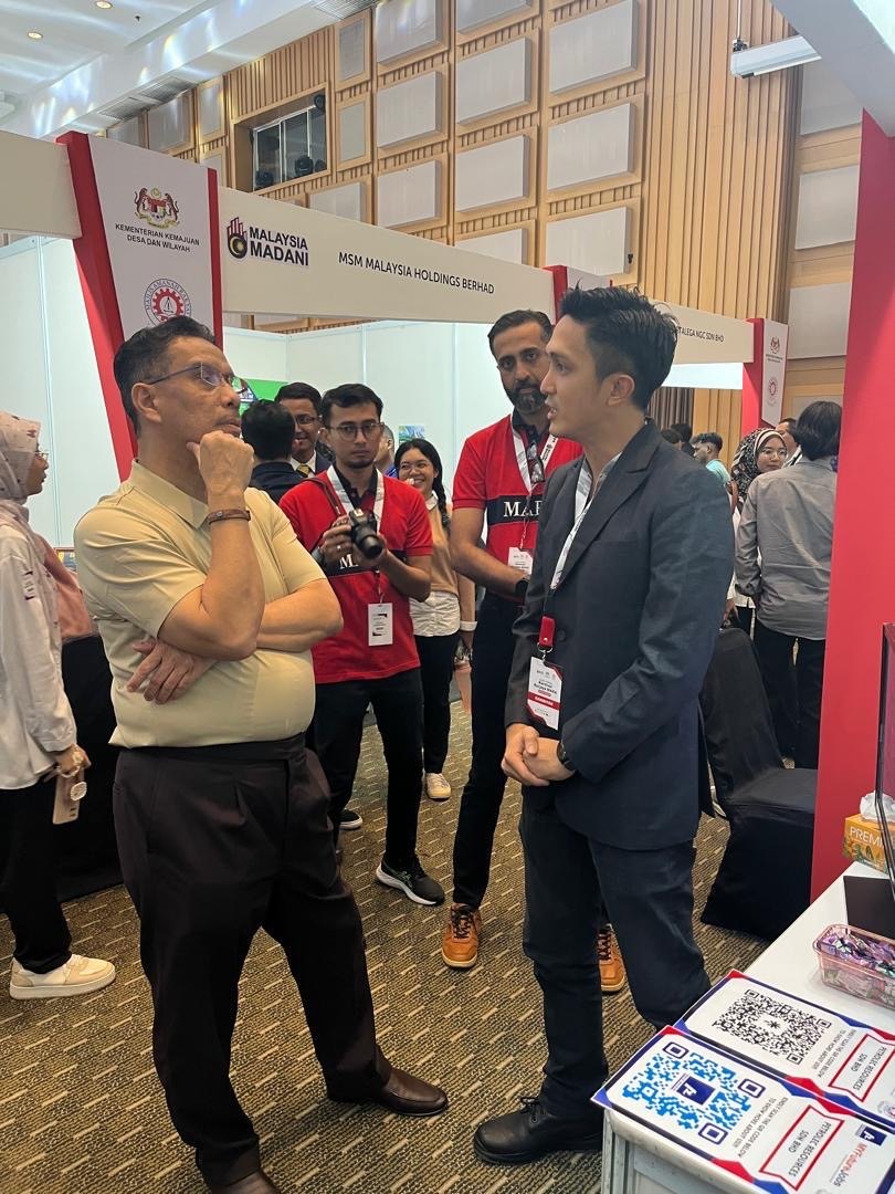 PETROLEC RESOURCES representatives at an industry exhibition