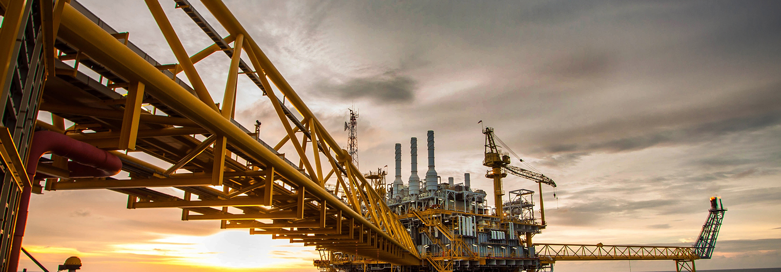 Petrolec Resources — Offshore oil platform at sunset