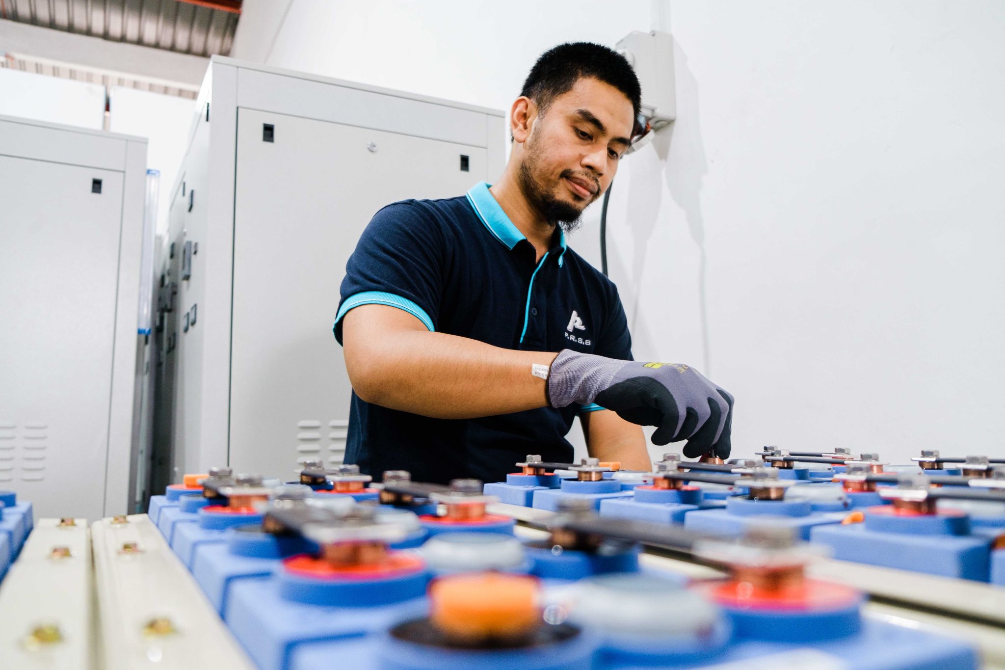 PRSB engineer servicing an industrial battery bank