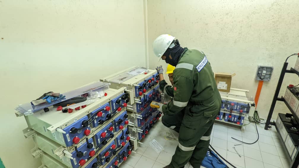 Petrolec engineer with industrial battery bank